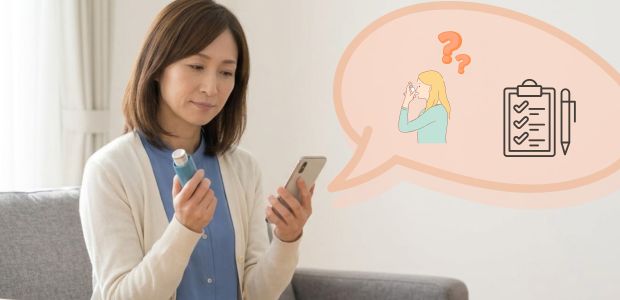 喘息の吸入薬の使用方法を確認している女性